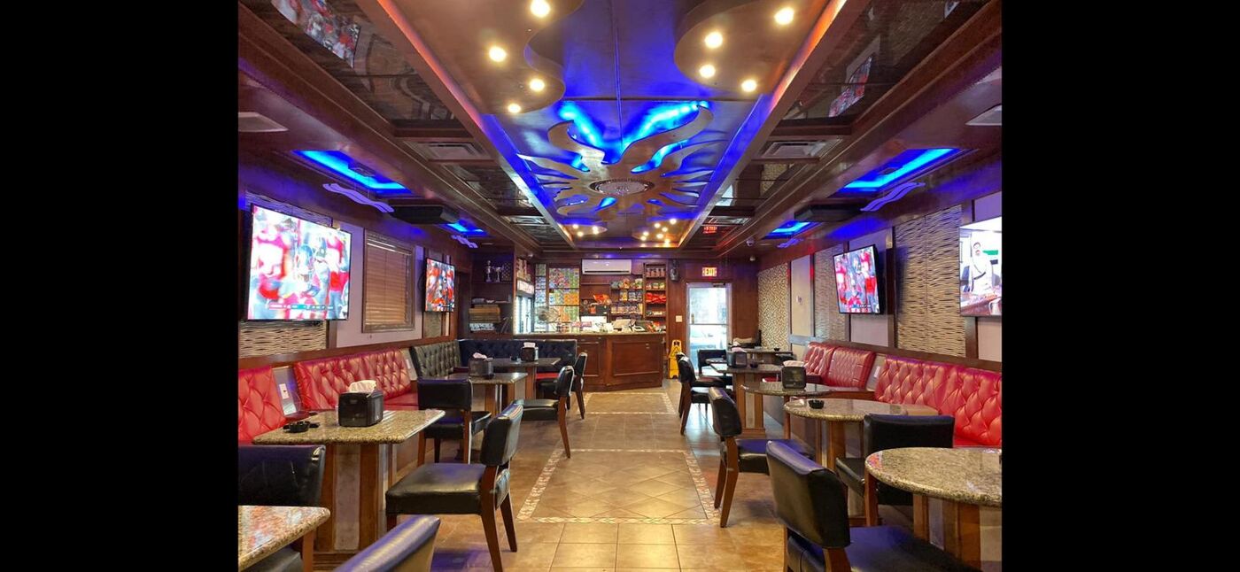 Babylon Hookah Lounge seating with blue accent lighting