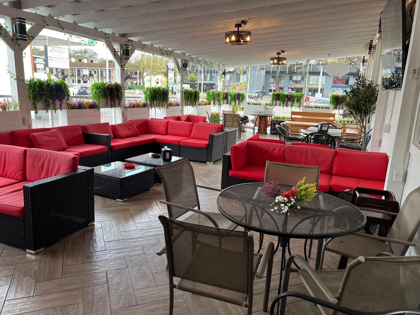 Babylon Hookah Lounge patio with red sectional seating